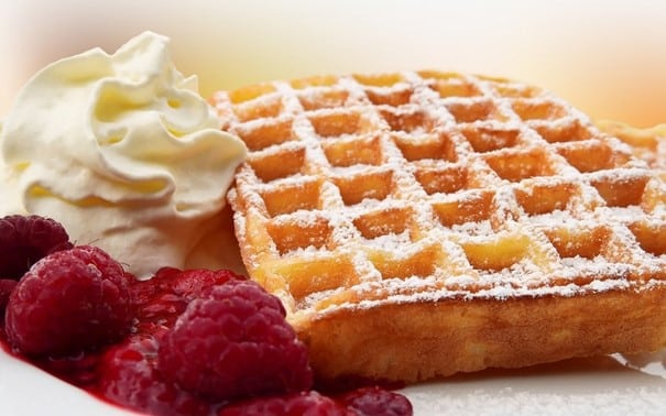 Waffle, raspberries and whipped cream