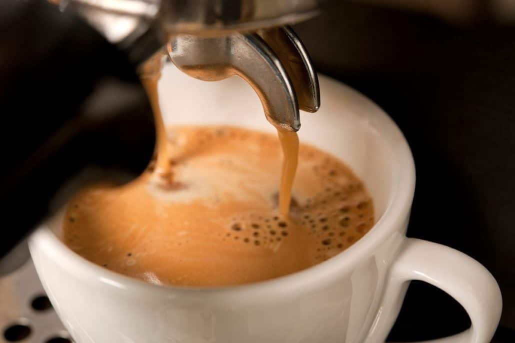 Espresso coffee under the machine