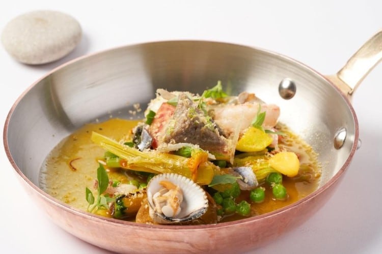 Pan-fried veal with shellfish and vegetables